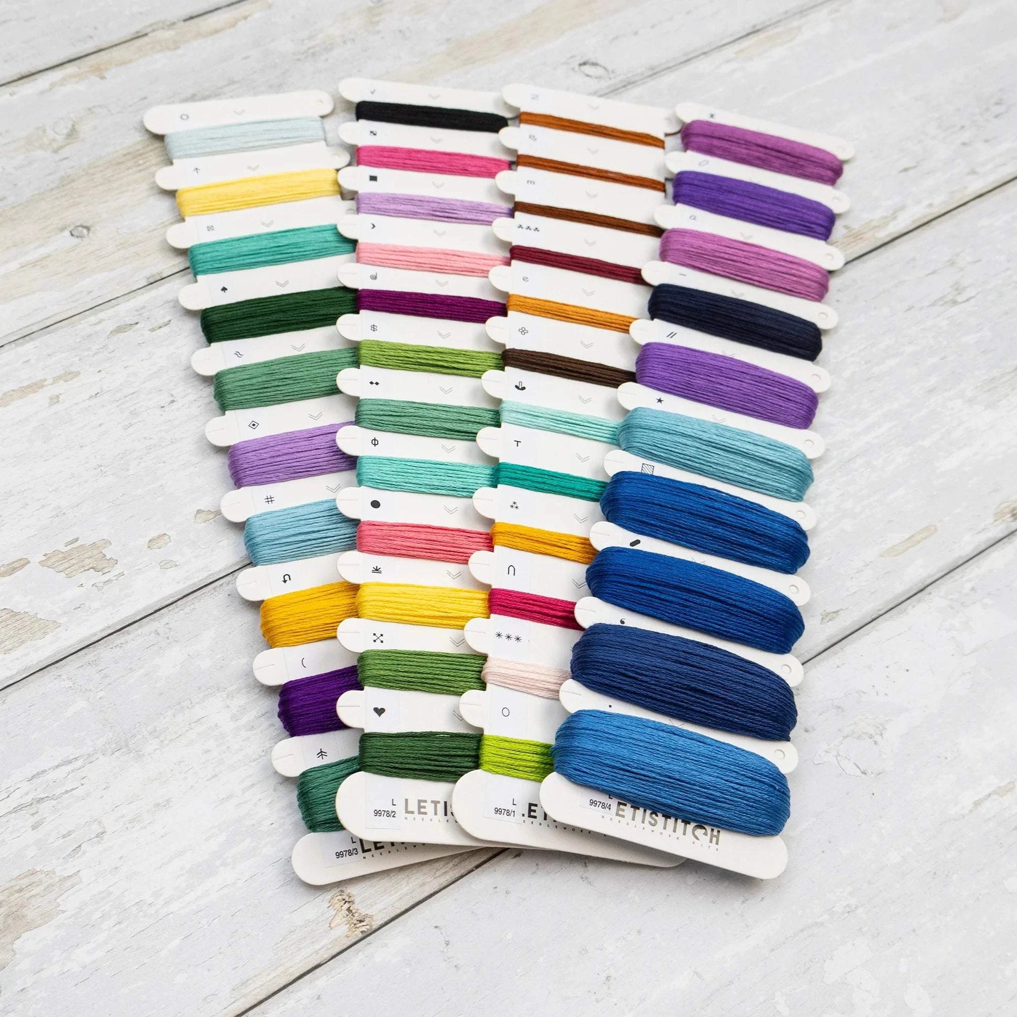 Celestial Isles Cross Stitch Kit with 16 count white Aida fabric, cotton threads, needle, and instructions