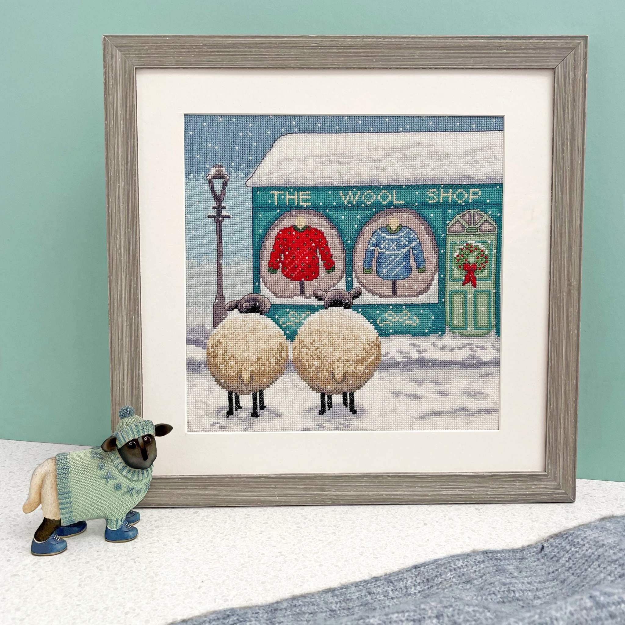 The Wool Shop cross stitch kit with 14 count white Aida fabric and pre-sorted cotton threads