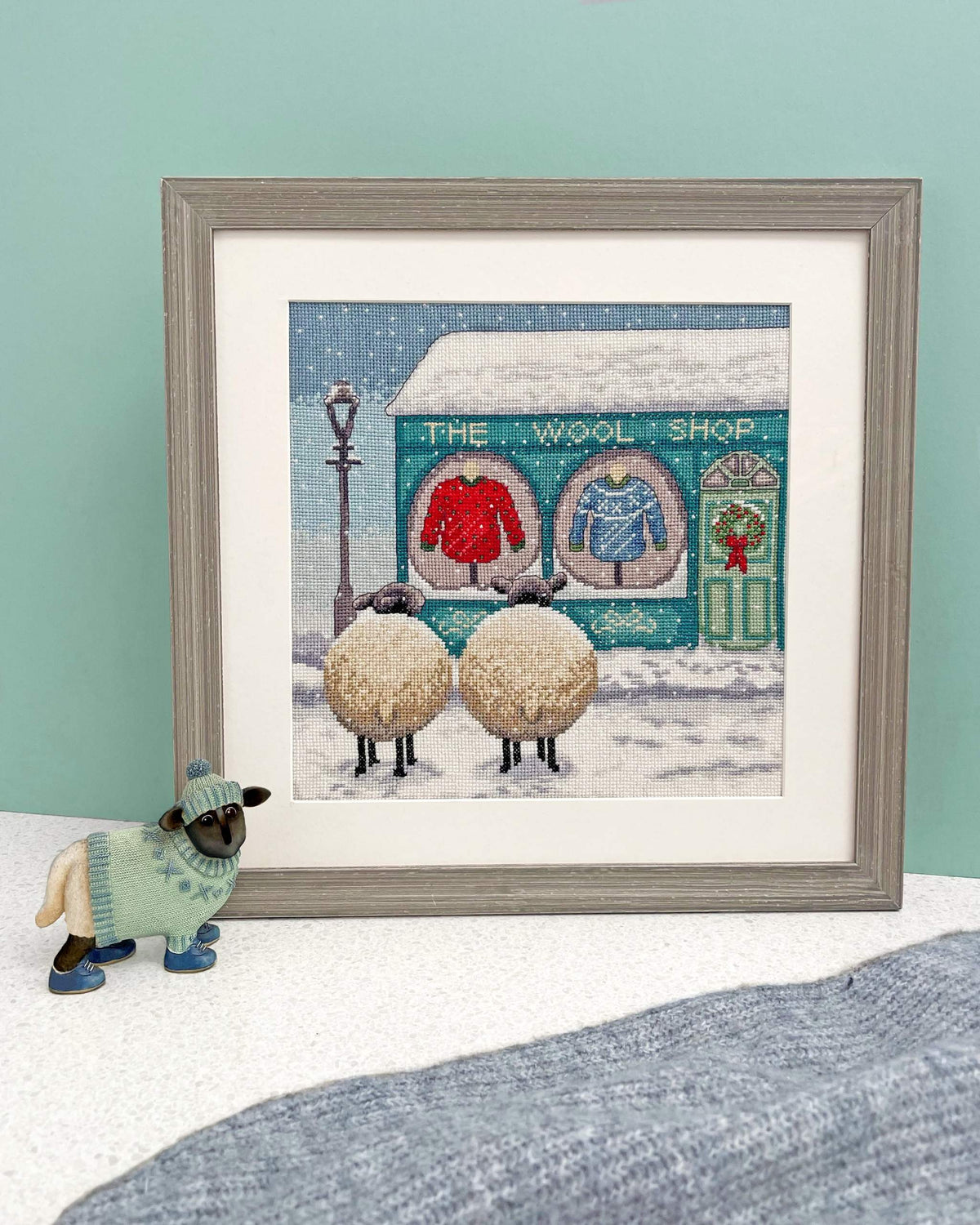 The Wool Shop cross stitch kit with 14 count white Aida fabric and pre-sorted cotton threads