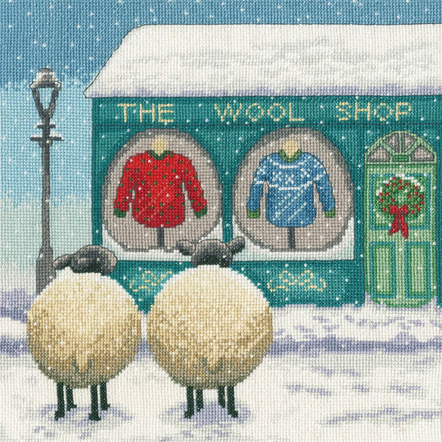 The Wool Shop featuring two sheep, cross stitch kit with 14 count white Aida, cotton threads, needle, and instructions