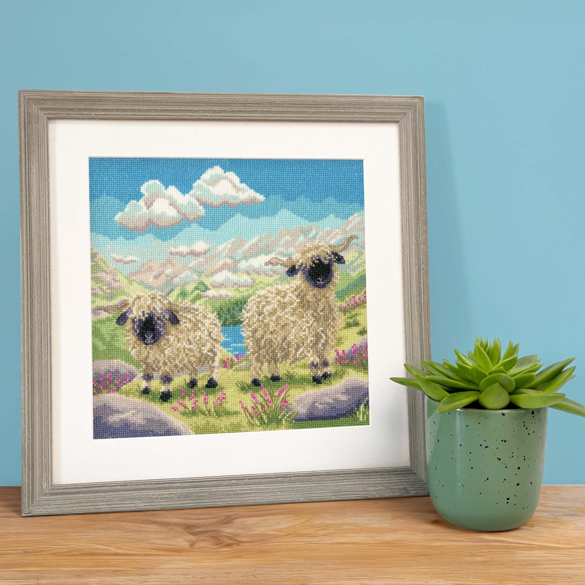 Finished Spag and Hetti sheep cross stitch design by Bothy Threads shown framed