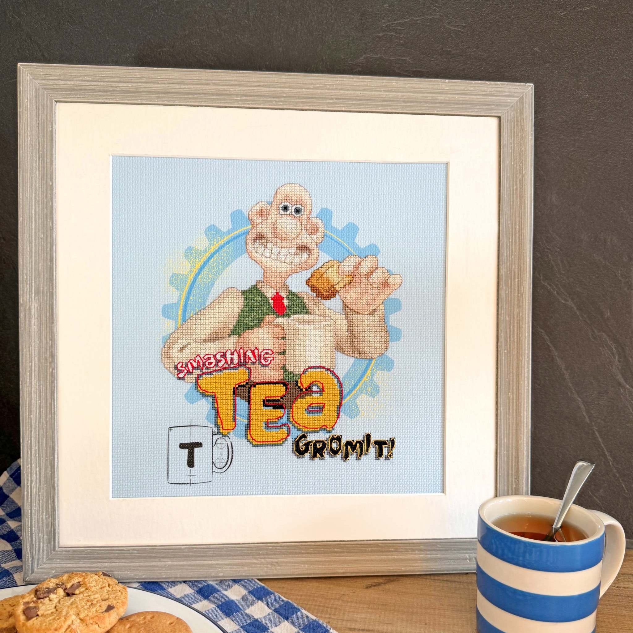 Wallace & Gromit Smashing Tea cross stitch kit with printed Aida fabric and needle