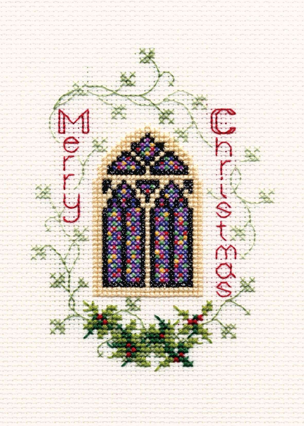 Counted cross stitch Christmas card kit featuring stained glass window design with "Merry Christmas" text and holly embellishments