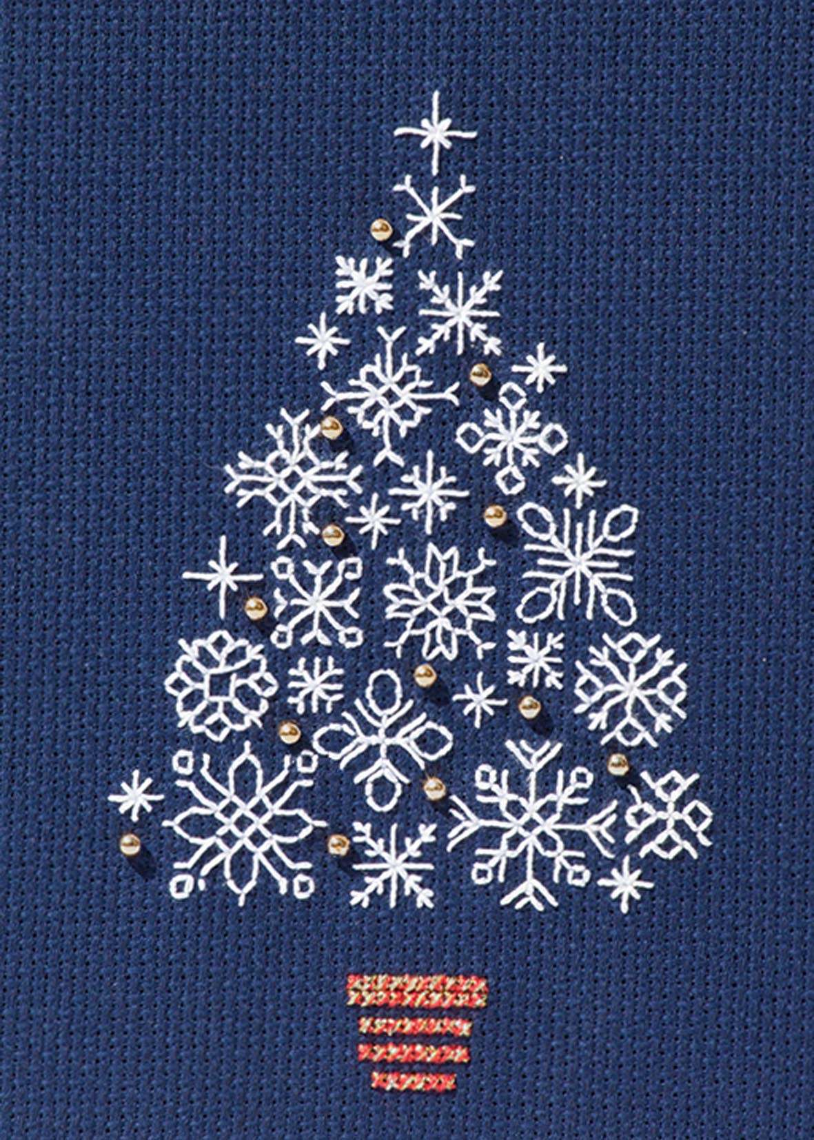 Snowflake Tree cross stitch pattern on navy aida fabric with metallic thread accents forming a Christmas tree shape