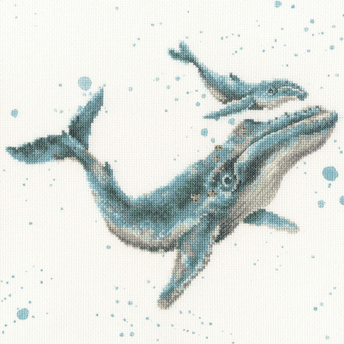Detailed marine blue cross stitch kit design featuring a mother whale and calf swimming with blue bubble background