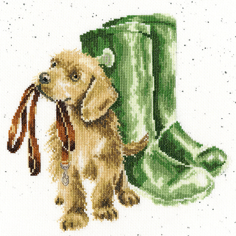 Cross stitch kit design of a dog holding a lead next to green wellies by Bothy Threads