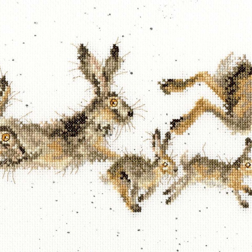 Cross stitch kit featuring a springtime design of hares and babies on speckled 14 count Aida fabric