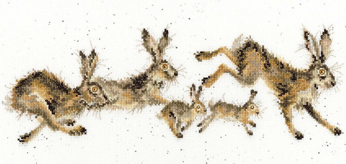 Cross stitch kit featuring a springtime design of hares and babies on speckled 14 count Aida fabric