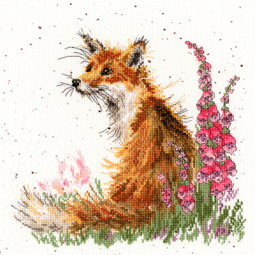 Cross stitch of a fox sitting amongst pink foxgloves flowers on speckled fabric