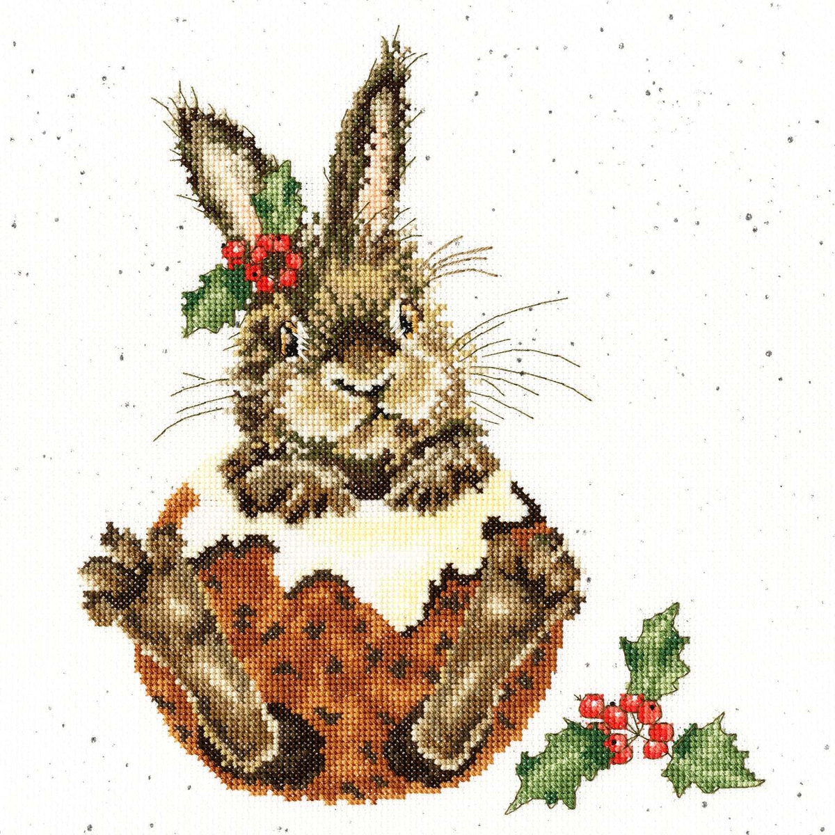 Little Pudding cross stitch kit featuring a bunny inside a Christmas pudding with holly accents
