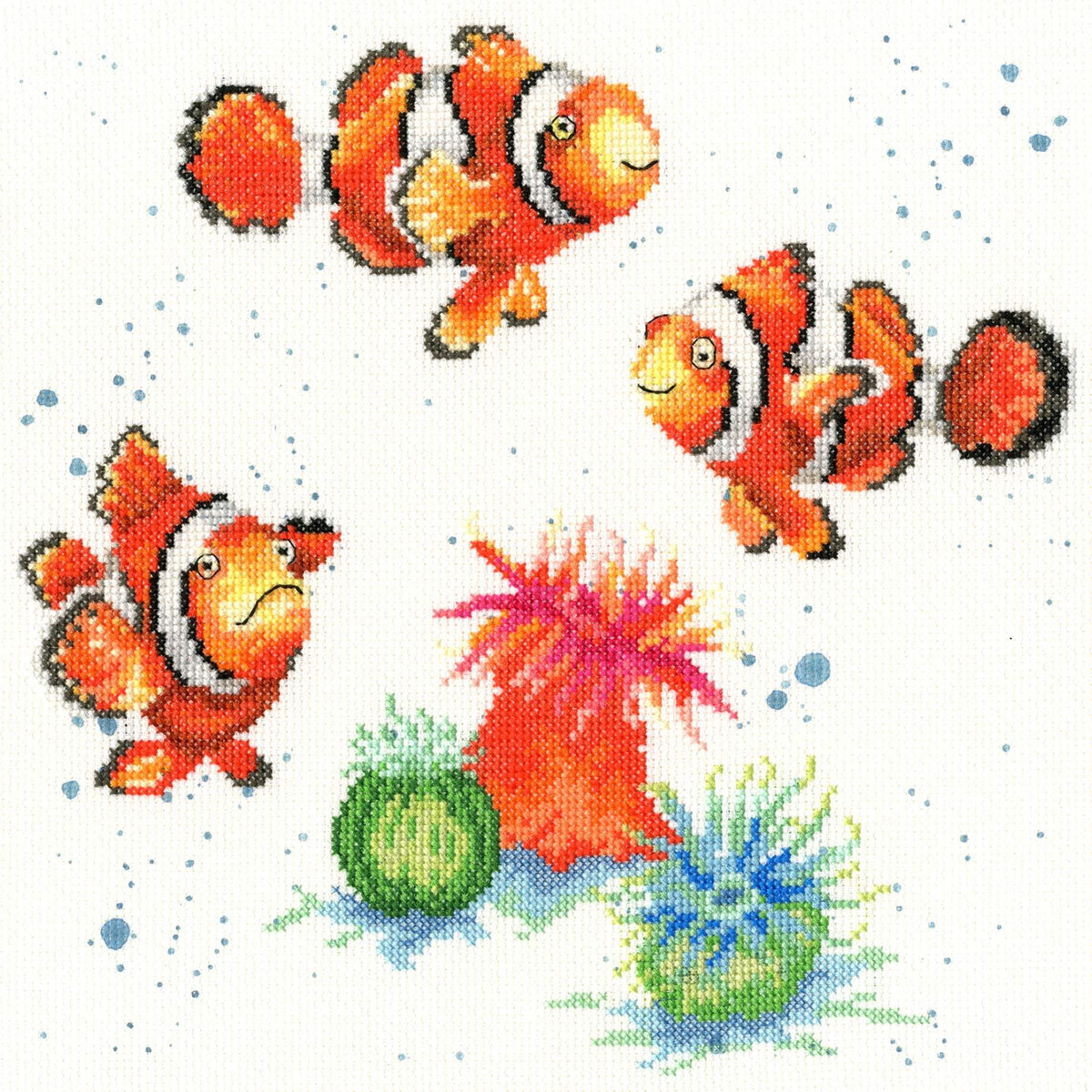 Clowning Around Cross Stitch Kit featuring colorful clownfish and sea anemones on white fabric