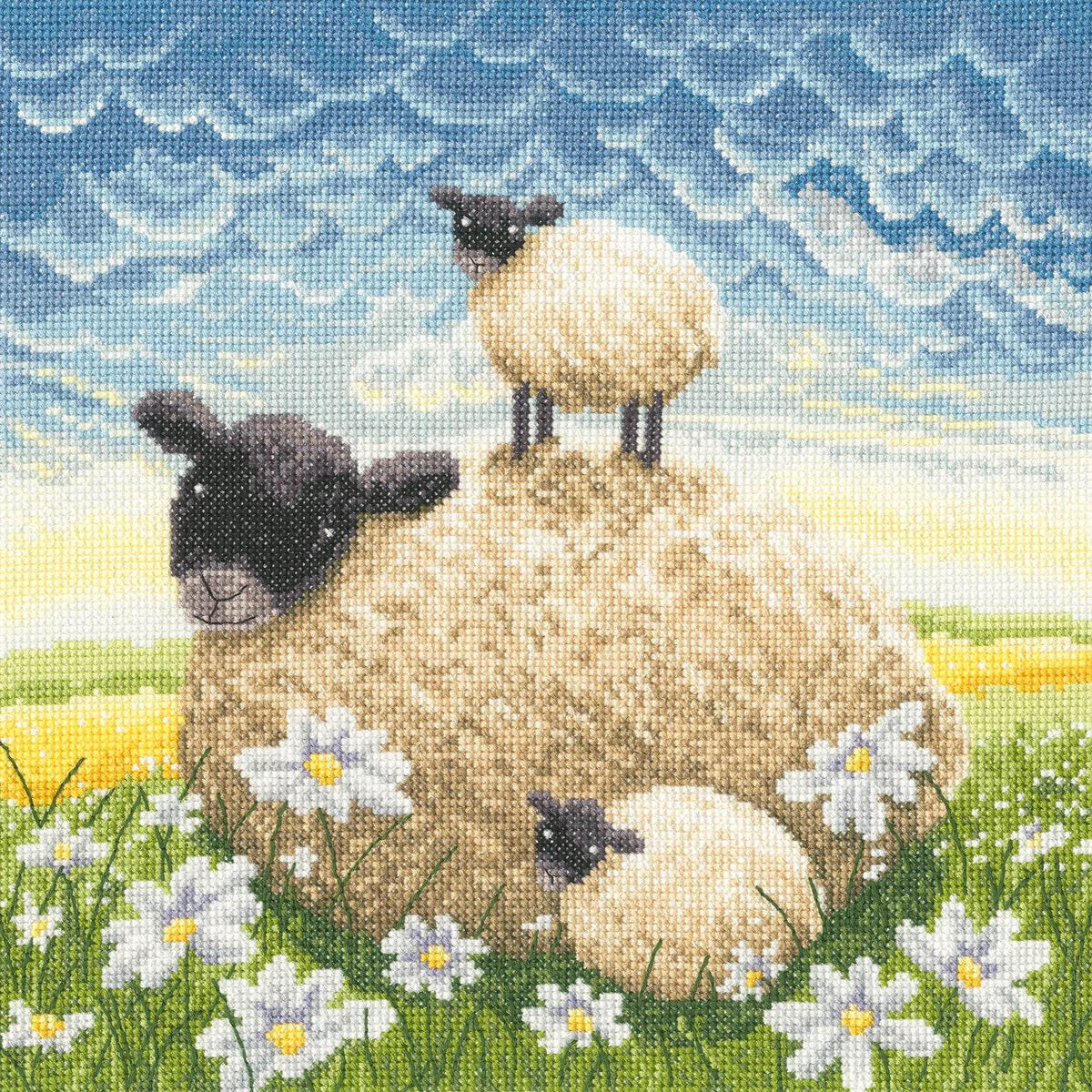 Double Trouble Cross Stitch Kit featuring two black-faced sheep in a floral meadow under a blue cloudy sky