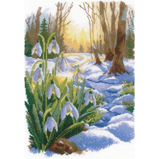 RIOLIS Spring is Coming counted cross stitch kit showing snowdrops in a snowy woodland with trees and soft sunrise light