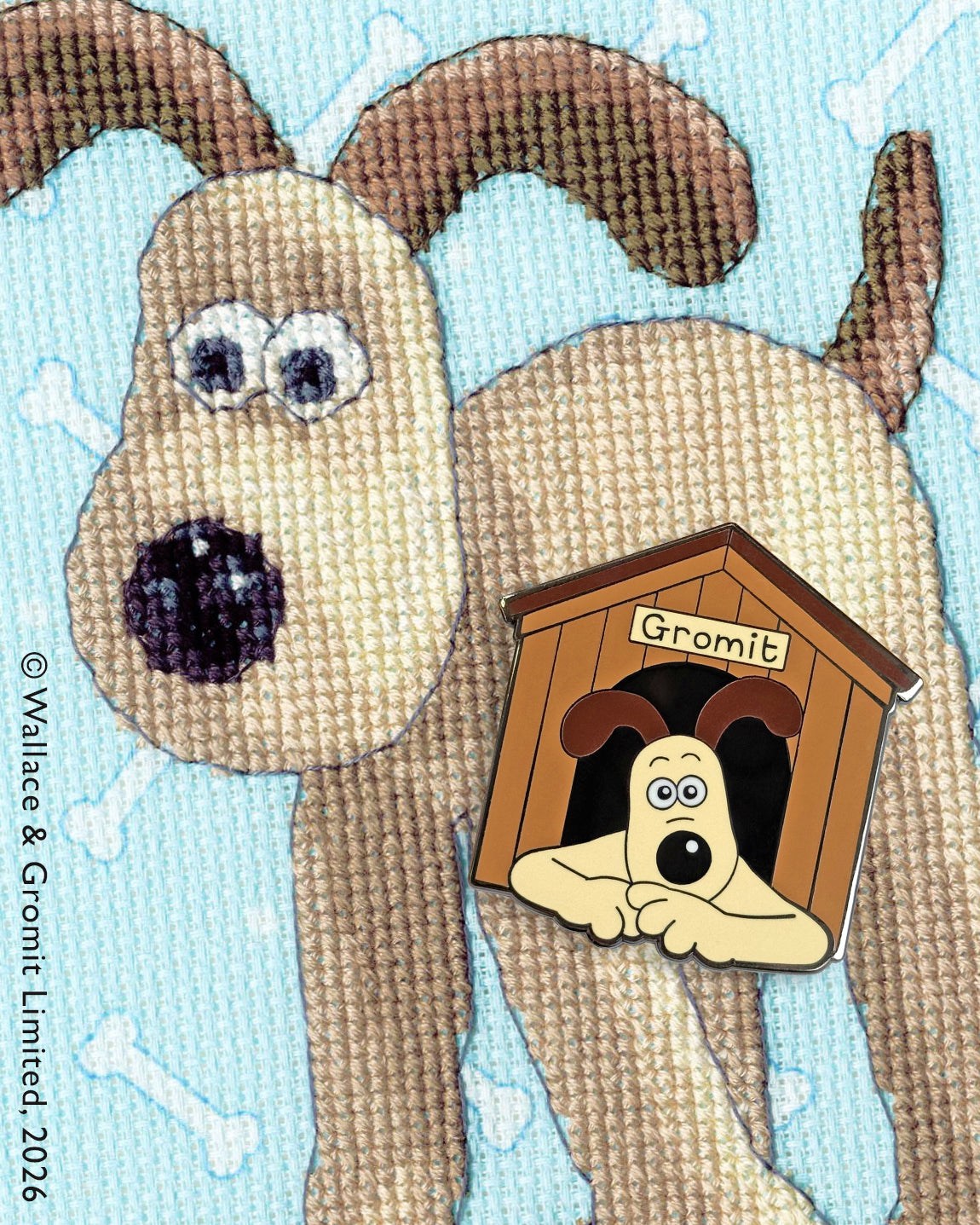 Magnetic Needle Minder with dog design holding needle and chart on fabric