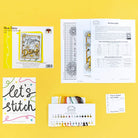 Nice Daisy Cross Stitch Kit with ice blue Aida fabric, cotton threads, needle, and instructions