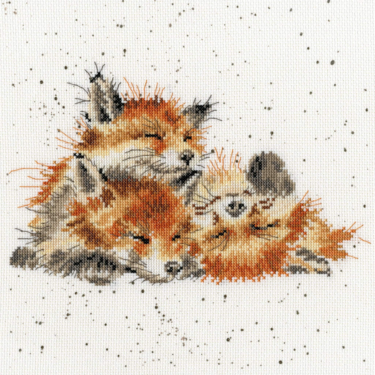 Three sleeping fox cubs cross stitched on speckled 14 count Aida fabric from Afternoon Nap Cross Stitch Kit